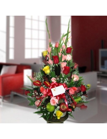 Arrangement with roses and assorted fruits